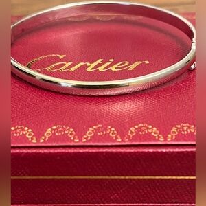 White gold bangle with two faced design .